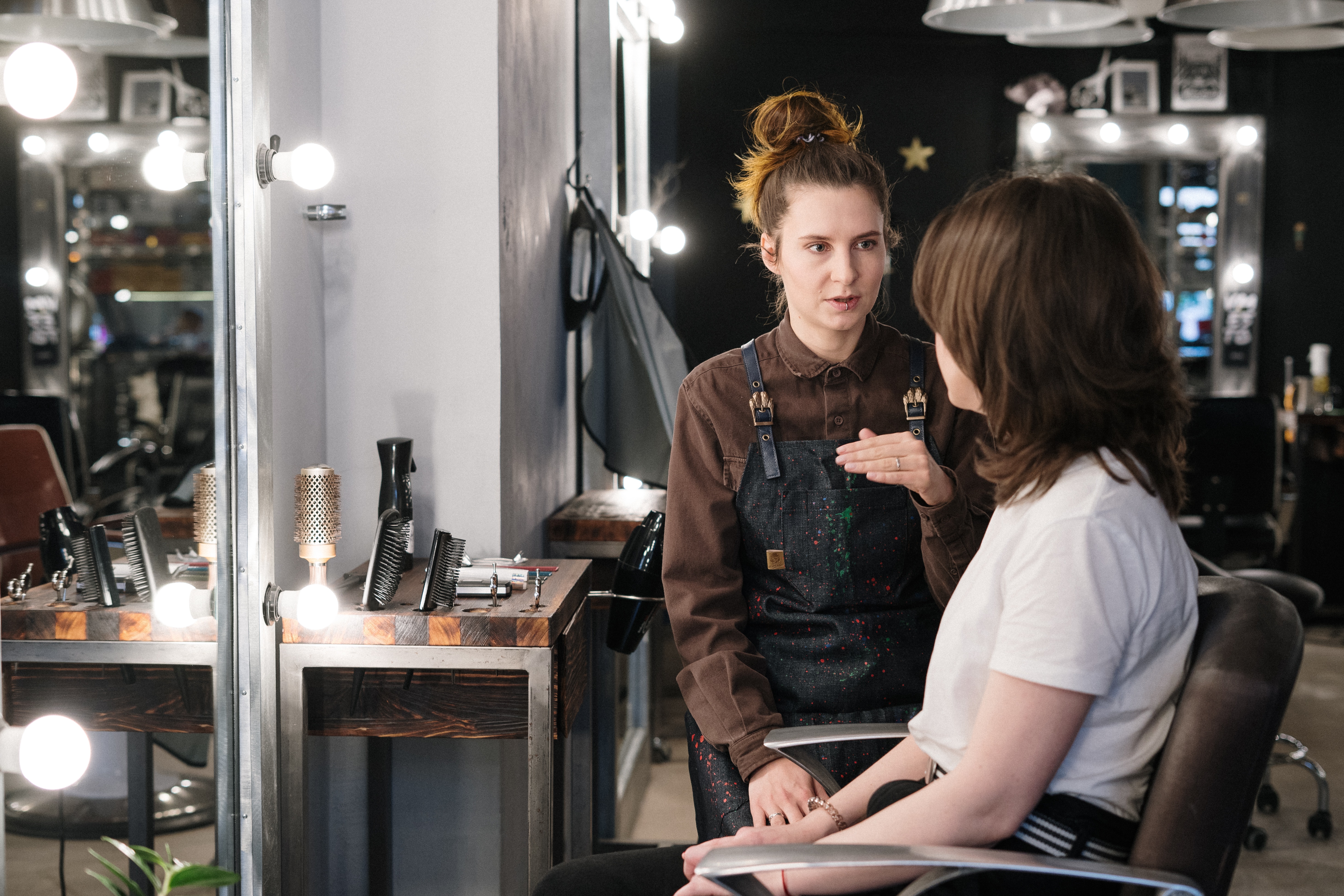 Hair stylist consulting with a client